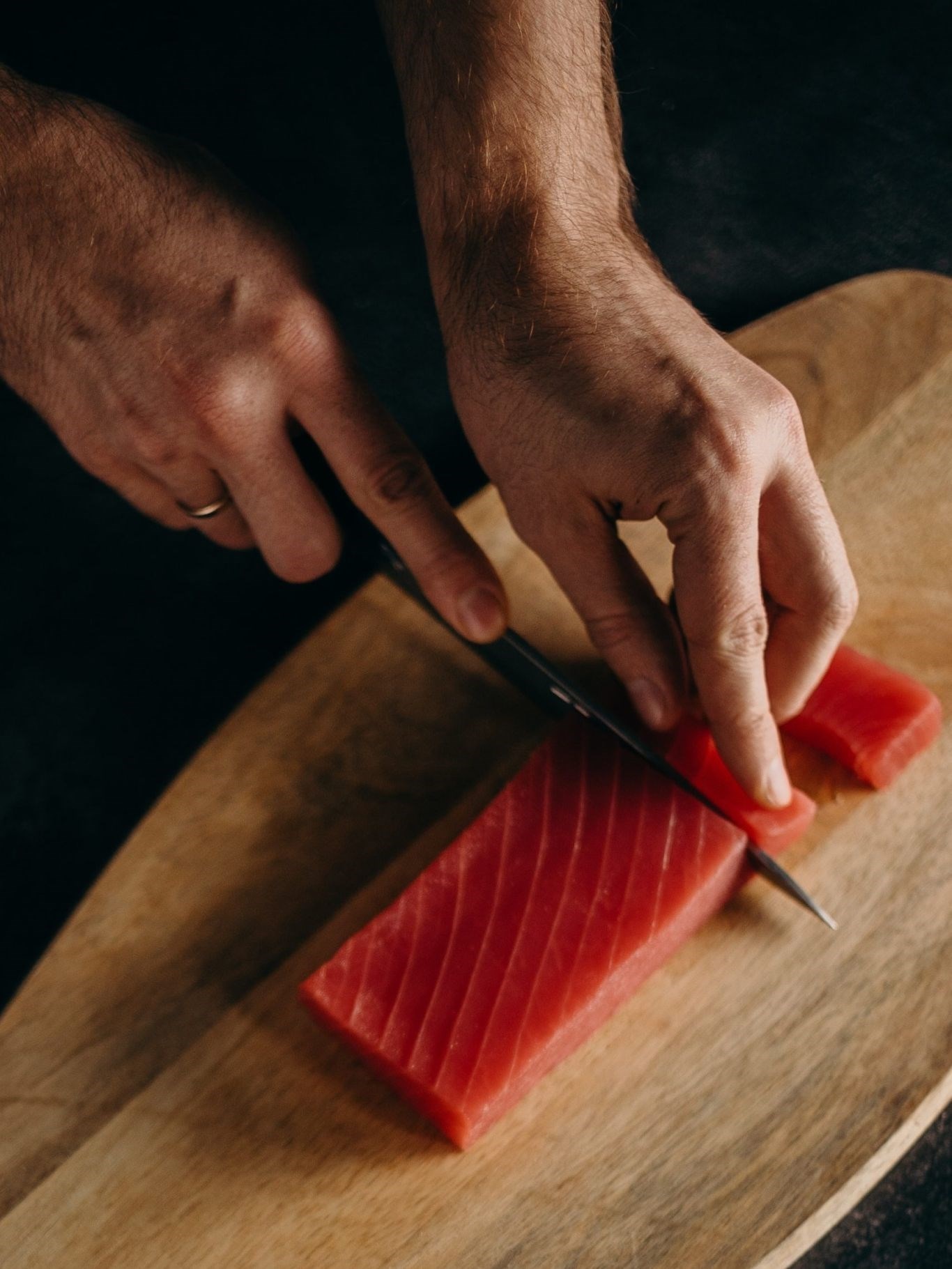 slicing-block-of-tuna-meat-3296397-scaled-285a830d